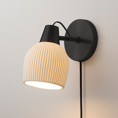 NOVA of California Petaluma Bone Porcelain Wall Sconce Matte Black — styled view